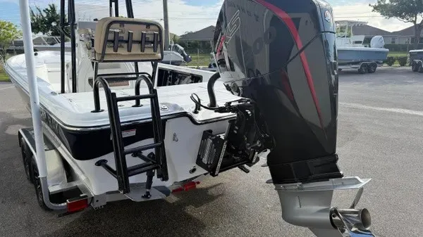 Slide: The Image of The image shows a 2026 Blazer PureBay 2400 boat with a large outboard motor. - 6