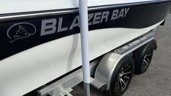 Slide: The Image of A 2026 Blazer PureBay 2400 on a trailer, featuring sleek design and distinctive wheels. - 4