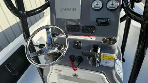 Slide: The Image of The image shows the helm of a Blazer PureBay 2200 boat with Garmin equipment. - 20