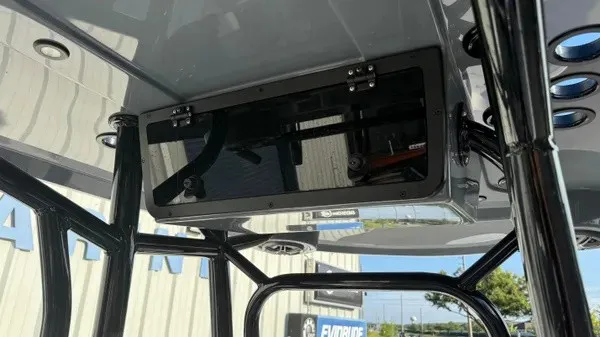 Slide: The Image of The image shows a boat's roof with a black enclosure and several mounts. - 21