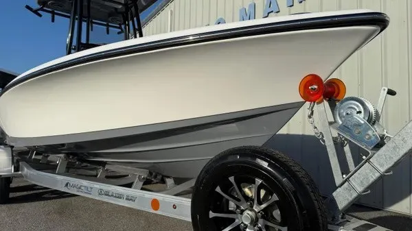 Slide: The Image of A 2026 Blazer PureBay 2200 on a trailer, featuring shiny black rims and orange lights. - 4