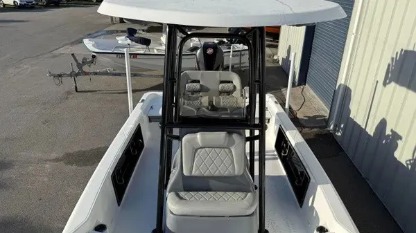 Slide: The Image of The image shows a 2026 Blazer PureBay 2200 boat with a spacious deck and cushioned seating. - 14