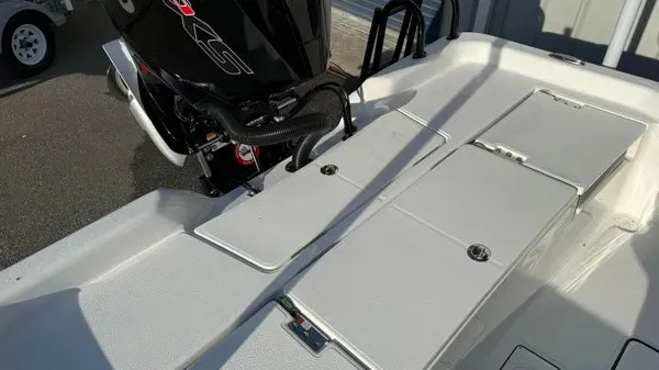 Slide: The Image of The image shows the deck of a Blazer PureBay 2200 boat with an outboard motor. - 25
