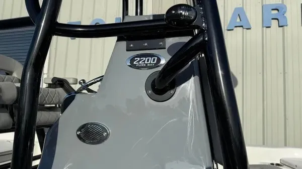 Slide: The Image of Close-up of a Blazer PureBay 2200 boat's helm with gray paneling. - 3
