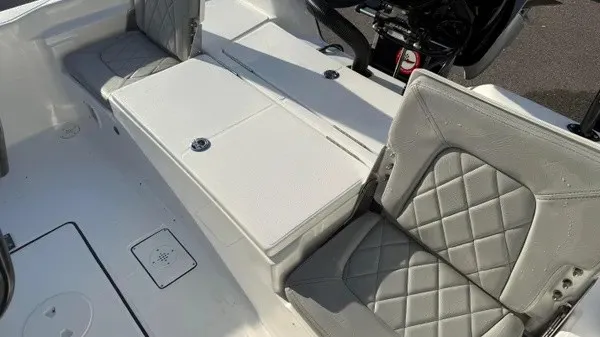 Slide: The Image of The image shows the interior of a Blazer PureBay 2200 with gray, quilted seats. - 26