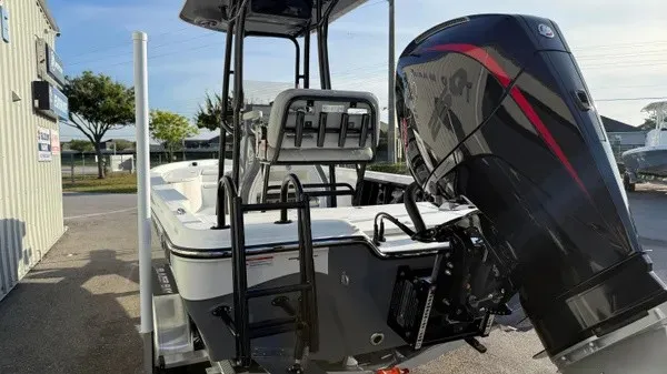 Slide: The Image of A 2026 Blazer PureBay 2200 with a powerful outboard motor, parked on a trailer. - 8