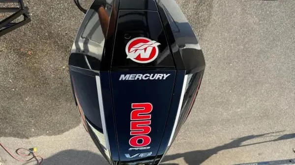Slide: The Image of A Mercury 250 HP V8 outboard motor is mounted on a boat. - 31