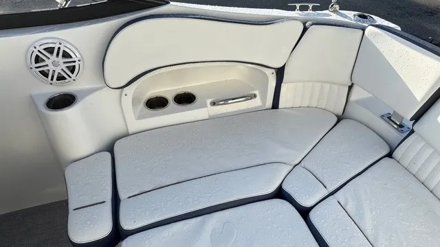 Slide: The Image of The 2027 Stingray 211 DC features a white cushioned seating area with cup holders and a speaker. - 17