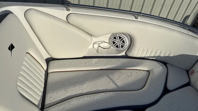 Slide: The Image of The image shows the white upholstery of a 2027 Stingray 211 DC with a speaker. - 13