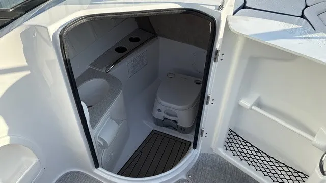 Slide: The Image of The image shows the interior of a boat bathroom with a toilet and sink. - 11