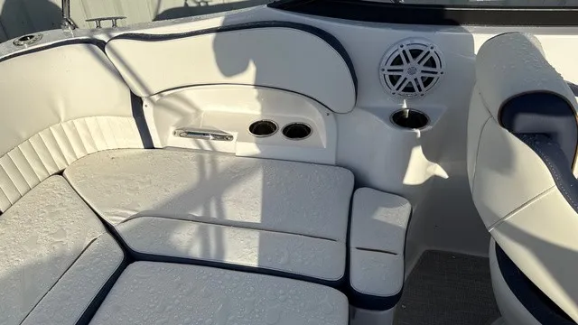 Slide: The Image of The 2027 Stingray 211 DC features a white cushioned seating area with blue accents and a speaker. - 18