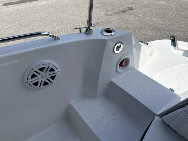 Slide: The Image of The image shows the stern of a 2027 Stingray 212 SC boat with a speaker and cup holder. - 19