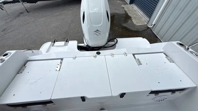 Slide: The Image of The image shows the stern of a Stingray 173 CC boat with a Suzuki outboard motor. - 9