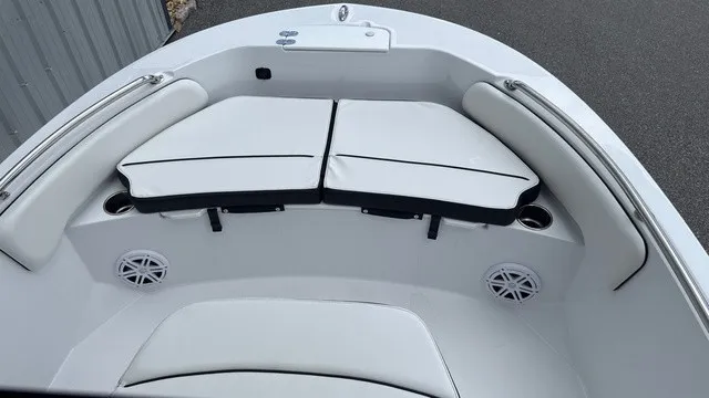Slide: The Image of The image shows the bow of a Stingray 173 CC boat with white cushions and speakers. - 10