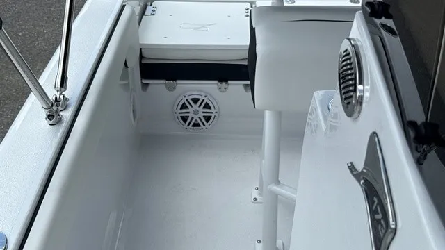 Slide: The Image of The image shows the cockpit of a 2027 Stingray 173 CC boat with white seating and speakers. - 14