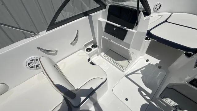 Slide: The Image of The image shows the cockpit of a Stingray 172 DC boat with white seating and modern fixtures. - 8