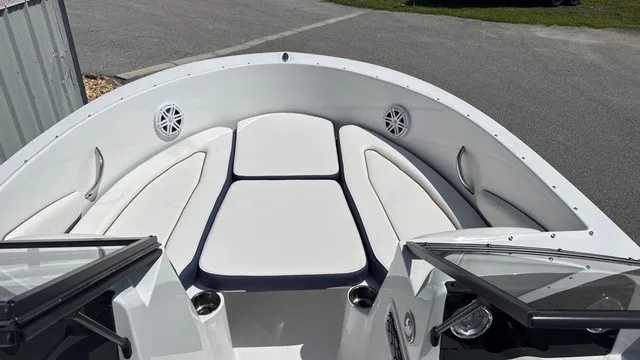 Slide: The Image of The image shows the bow of a Stingray 172 DC boat with white cushions. - 7