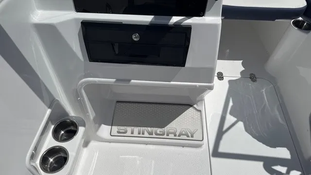 Slide: The Image of The image shows the interior of a Stingray 172 DC boat with cup holders and a storage compartment. - 10