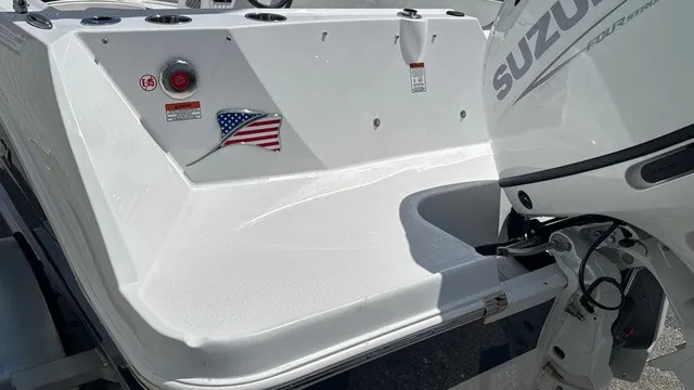 Slide: The Image of The image shows the stern of a Stingray 172 DC boat with a Suzuki outboard motor. - 4