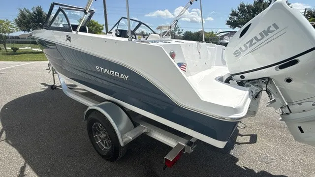 Slide: The Image of Stingray 172 DC 2027 with Suzuki outboard motor on a trailer. - 5