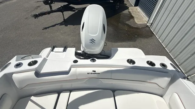 Slide: The Image of The image shows the stern of a Stingray 172 DC boat with an outboard motor. - 16