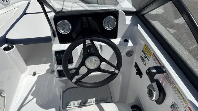 Slide: The Image of Steering wheel and dashboard of a 2027 Stingray 172 DC boat. - 11