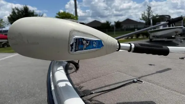 Slide: The Image of Close-up of a boat motor on a 2006 Stratos 294 Pro XL, with blue sky in the background. - 7