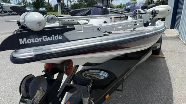 Slide: The Image of A 2006 Stratos 294 Pro XL boat on a trailer, equipped with a MotorGuide motor. - 8