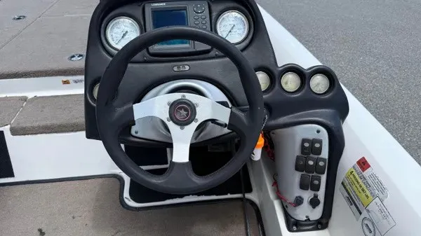 Slide: The Image of The image shows the cockpit of a 2006 Stratos 294 Pro XL with a steering wheel and instruments. - 11