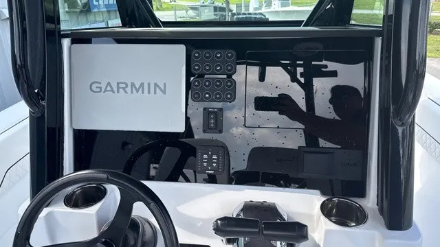Slide: The Image of The image shows the cockpit of a Stingray 253 CC boat with a Garmin navigation system. - 8