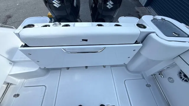 Slide: The Image of The image shows the stern of a Stingray 253 CC boat with two outboard engines. - 17