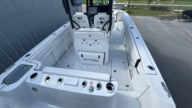 Slide: The Image of The image shows the cockpit of a 2027 Stingray 253 CC boat with modern seating and controls. - 7