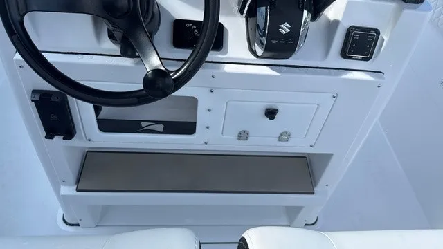 Slide: The Image of Boat console with steering wheel and controls. - 14