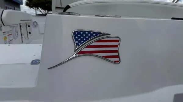 Slide: The Image of Close-up of a boat with an American flag emblem on a white background. - 3