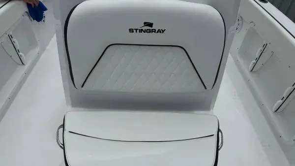 Slide: The Image of The 2027 Stingray 206 CC features sleek white upholstery with black accents. - 19