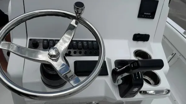 Slide: The Image of The image shows the helm of a Stingray 206 CC boat with modern controls. - 10
