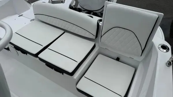 Slide: The Image of The 2027 Stingray 206 CC features white cushioned seats with black accents and elegant stitching. - 12