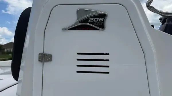 Slide: The Image of Close-up of the white 2027 Stingray 206 CC with logo and ventilation slits. - 4