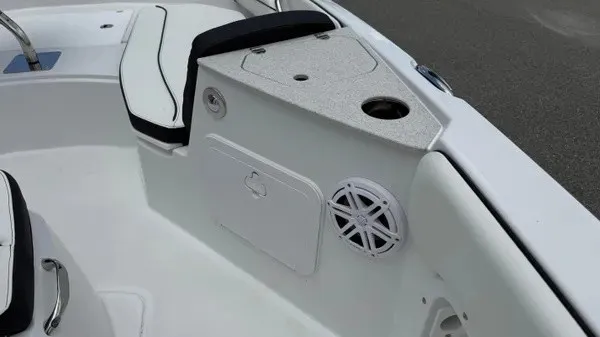 Slide: The Image of The image shows the cockpit of a Stingray 206 CC boat with white upholstery and a speaker. - 17
