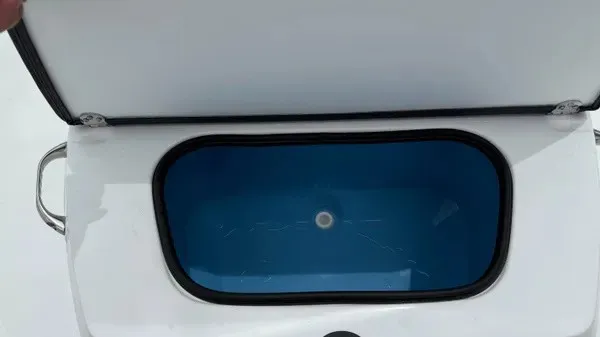 Slide: The Image of An open storage compartment with a blue interior on a boat. - 20