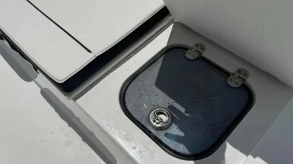 Slide: The Image of A boat with a small, rectangular hatch secured with hinges. - 19