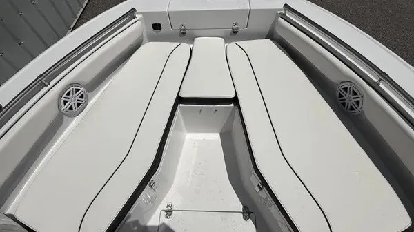 Slide: The Image of The 2027 Stingray 216 CC features a spacious, cushioned seating arrangement in the bow area. - 11