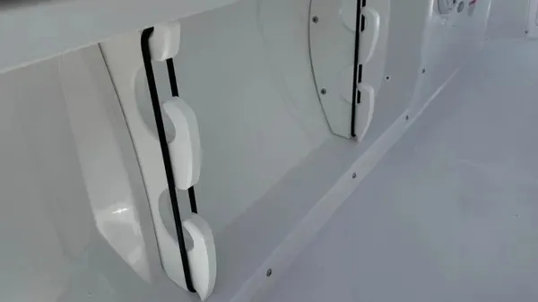 Slide: The Image of Close-up of a white boat deck with brackets and hinges. - 16