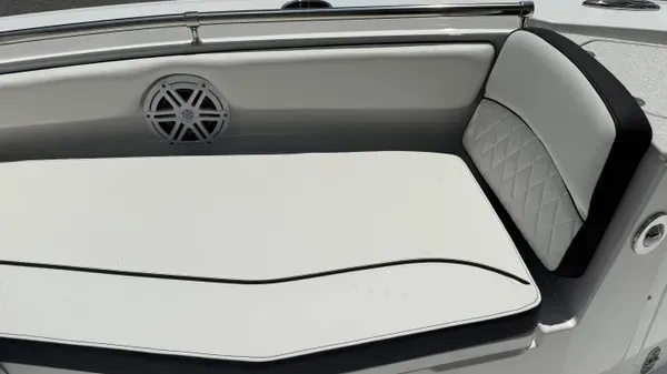 Slide: The Image of The 2027 Stingray 216 CC features an elegant cushioned bench with a speaker on the side. - 22