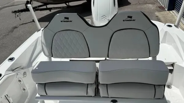 Slide: The Image of The 2027 Stingray 216 CC features a stylish, cushioned bench seat with a modern design. - 17