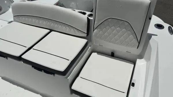Slide: The Image of The 2027 Stingray 216 CC features white cushioned seating with elegant stitching. - 18