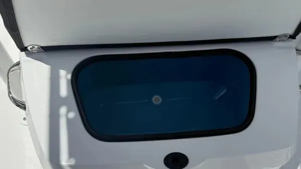 Slide: The Image of An open storage compartment on a boat with a blue interior. - 25