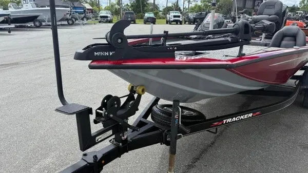 Slide: The Image of A 2023 Tracker Pro Team 195 TXW Tournament Edition boat on a trailer, ready for transport. - 10