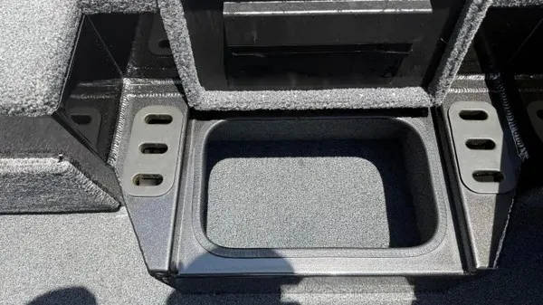 Slide: The Image of Close-up of a boat storage compartment with gray carpeting. - 16