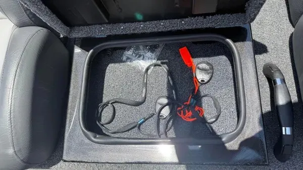 Slide: The Image of An open storage compartment in the Vexus AVX 2080 boat with cables and accessories. - 14